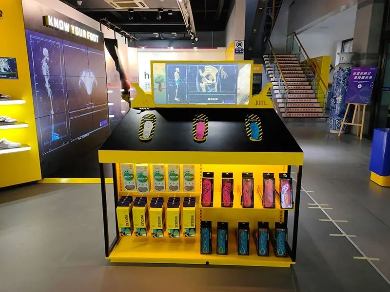 Modern interior of Footmagic’s shoe shop showcasing intelligent triggers and customer-focused displays.
